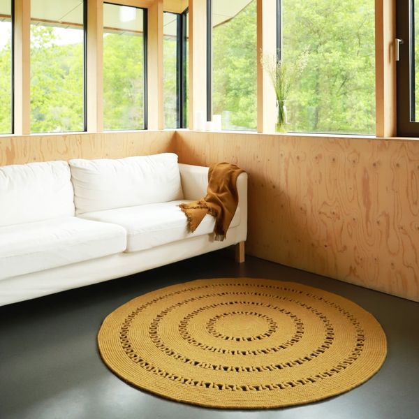 Horčicovožltý ručne vyrobený koberec zo zmesi vlny a bavlny Nattiot Bibek, ø 110 cm