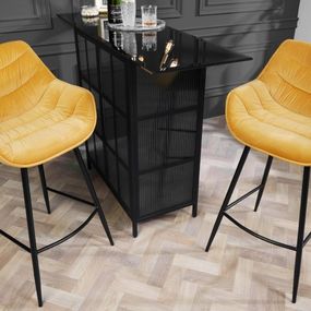 Estila Industriálna dizajnová barová stolička Kotor v žltom prevedení so zamatovým poťahom a čiernou kovovou konštrukciou 105cm